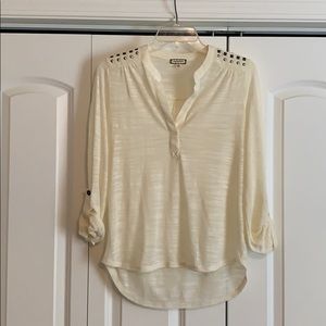 Size small ivory long sleeve.
